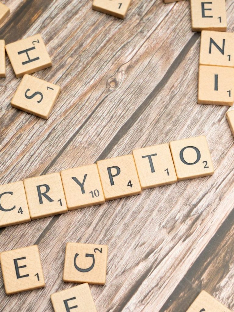 Crypto blockchain Scrabble wooden letter tiles on table